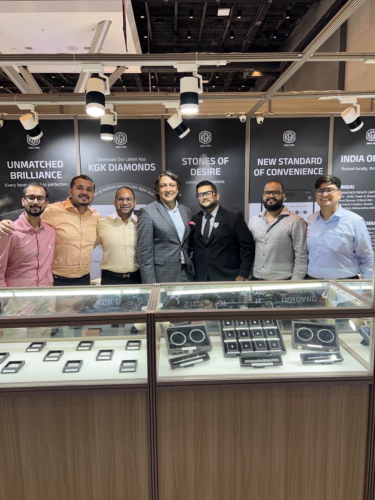 Group photo at the KGK Diamonds trade show booth