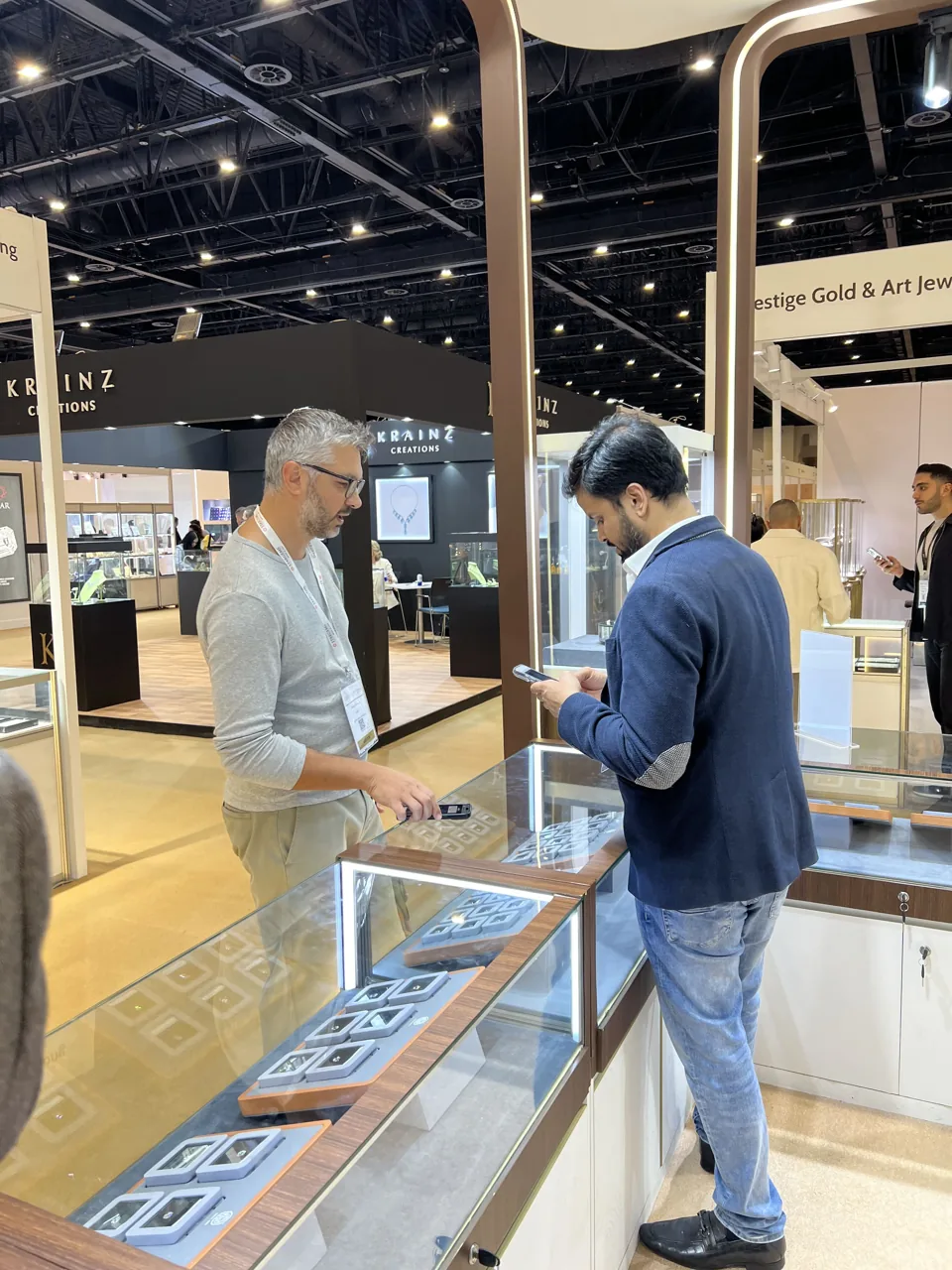 A conversation beside the KGK display counter
